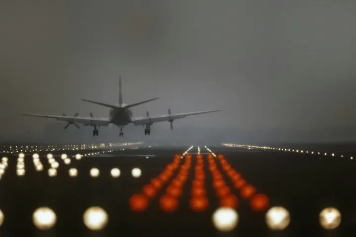 Runway approach lights glowing at night